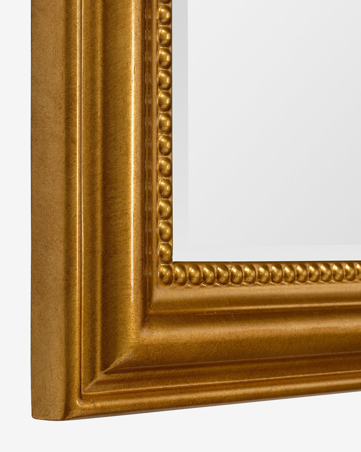 Close-up of the Vienna Mirror’s corner, showcasing its gold-leaf finish, beaded detailing, and timeless molded border framing a white background, by Vendixs