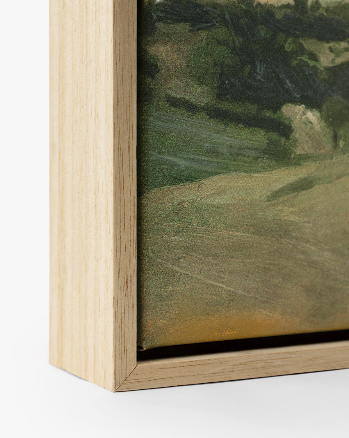 Close-up of the bottom corner of View of the Town, a landscape giclee print on canvas, framed with a light oak float frame and highlighting the artworks edge and textured surface by Vendixs