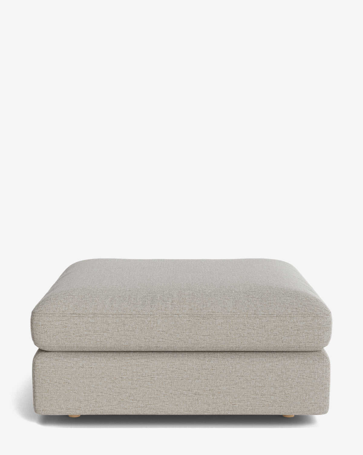 The Vivienne Modular Ottoman by Makerspalm is a modern, rectangular piece in light gray high-quality fabric with a soft, cushioned top and low wooden legs, shown against a plain white background by Vendixs