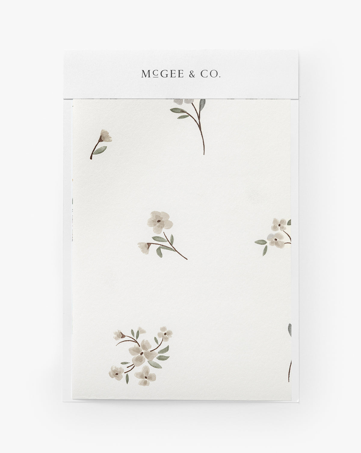 The Wembley Floral Wallpaper Swatch features delicate cream-colored flowers and green leaves on a white background, with a timeless design that adds an elegant touch to any room, by Vendixs