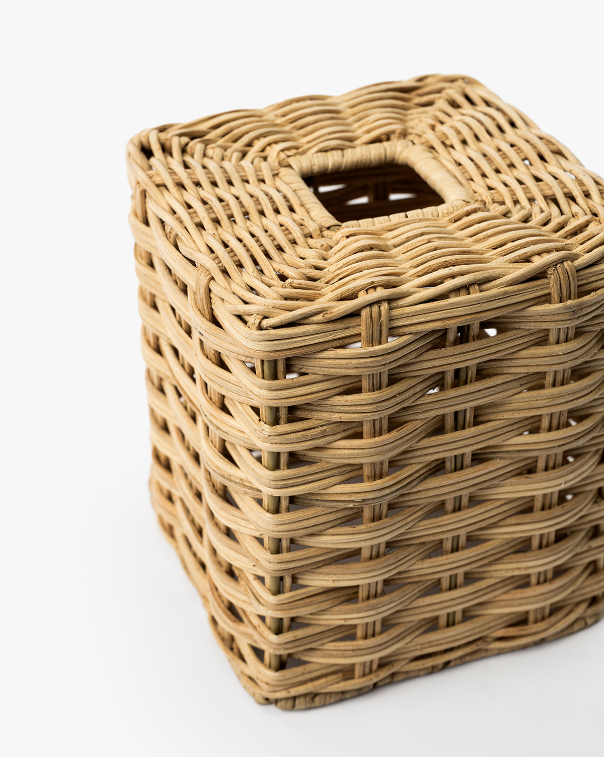 The Wicker Tissue Box Cover features a square woven design with a small rectangular opening on top, ideal for bathroom counter decor and shown against a white background, by Vendixs