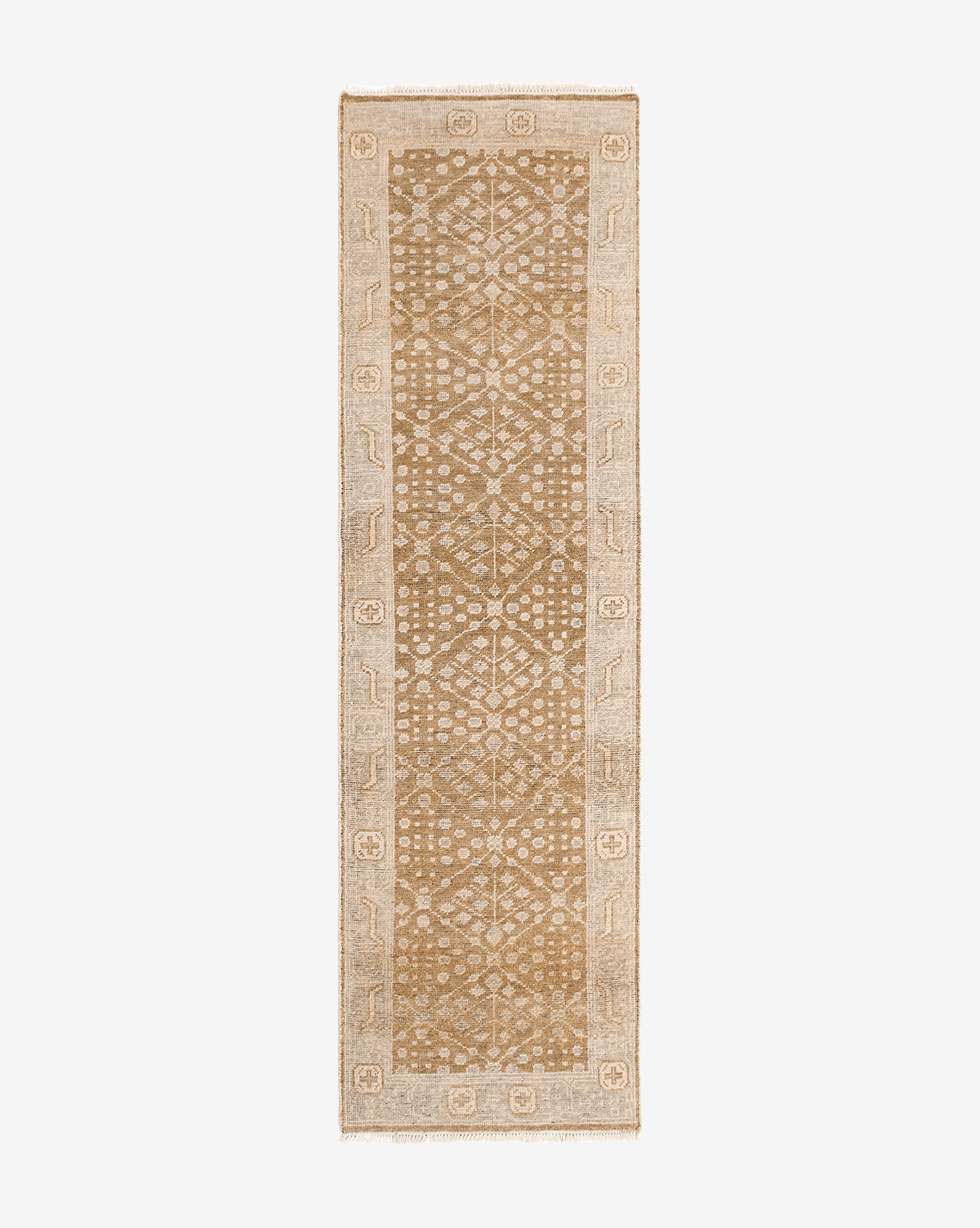 The Windsor Hand-Knotted Wool Rug is a rectangular beige and tan rug featuring a central geometric diamond pattern with a lighter decorative border, shown on a plain white background, by McGee & Co.