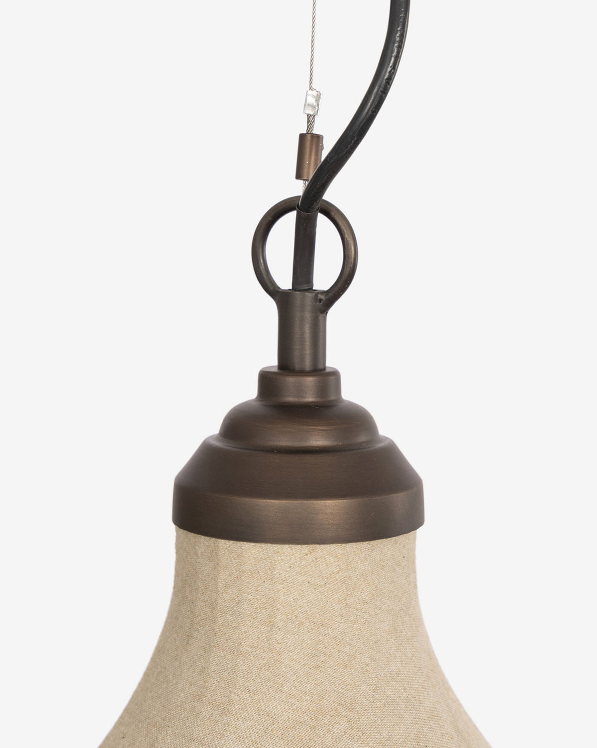 Close-up of the Winslet Pendant’s top, featuring a brass circular loop and beige linen shade, set against a plain white background—a perfect modern lighting piece, by McGee & Co.