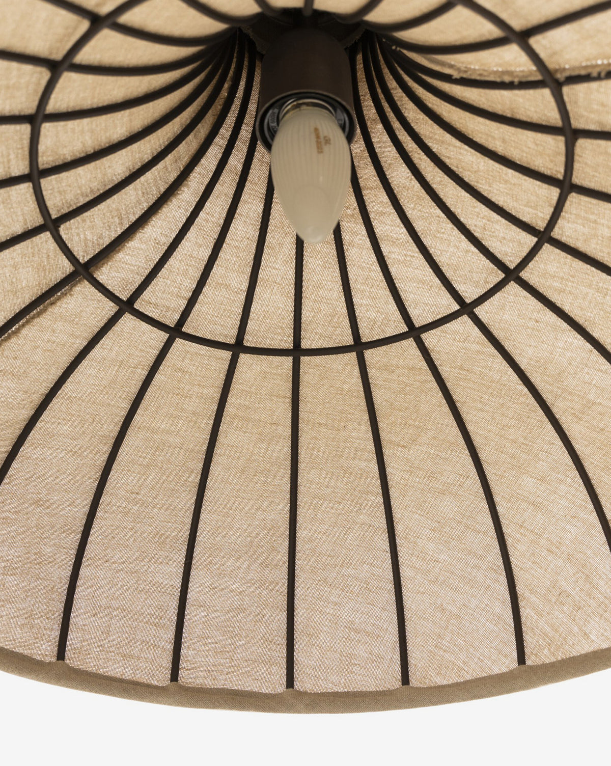 Close-up of the Winslet Pendant’s linen shade underside with black metal ribs and a single centered bulb—a striking detail in modern lighting, by Vendixs