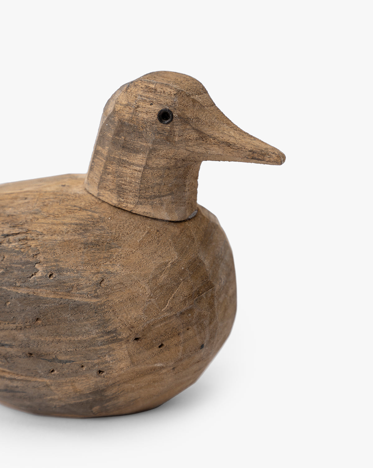The Wooden Bird Object features a smooth, rounded body, textured surface, carved beak, and small black eye—perfect for home decor and adding nature-inspired style to any space, by Vendixs