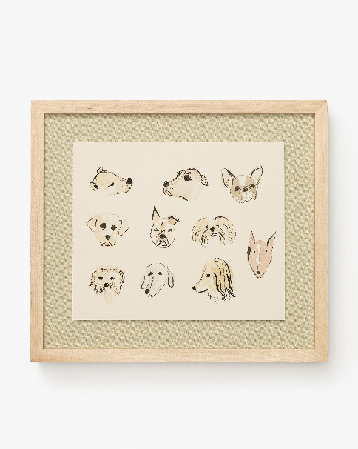 Woof is a fine art print of twelve unique, hand-drawn dog heads on a beige background in a sleek maple wood frame—perfect for adding charm to children’s room decor, by Vendixs