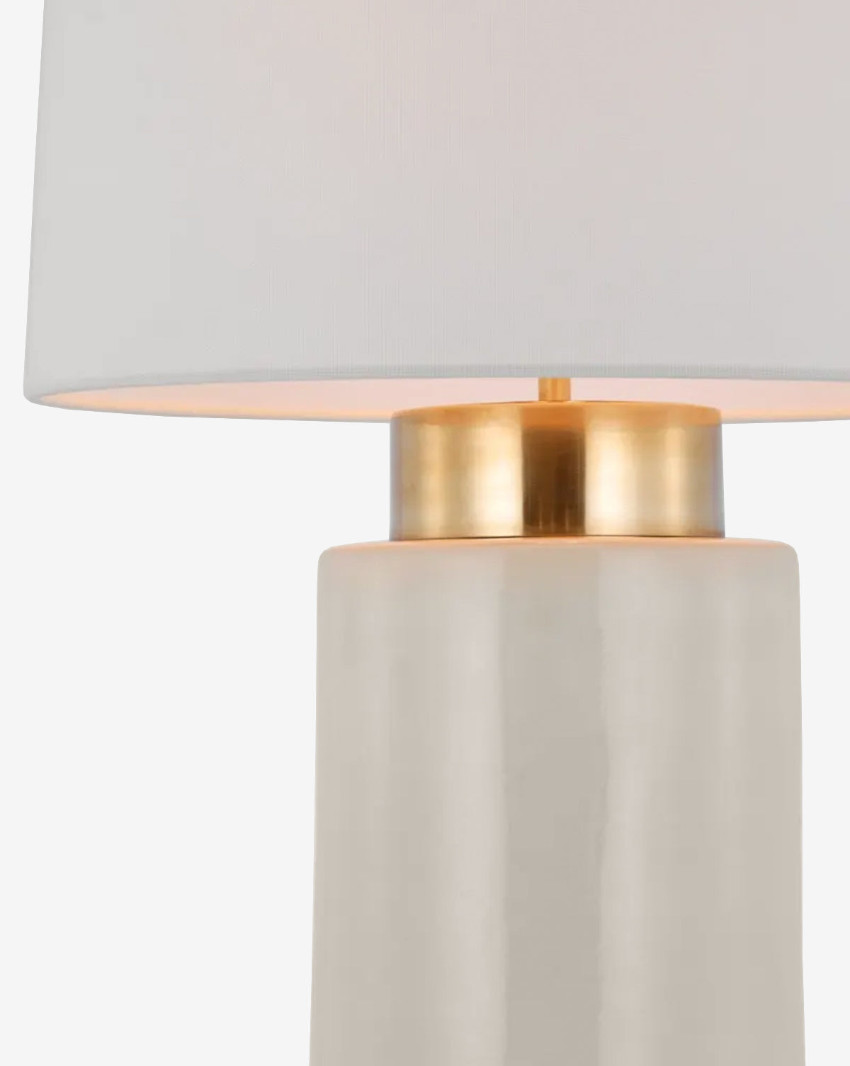 Close-up of the Xian Table Lamp, featuring a modern white ceramic base, gold accent near the top, and a crisp white linen shade, by Vendixs