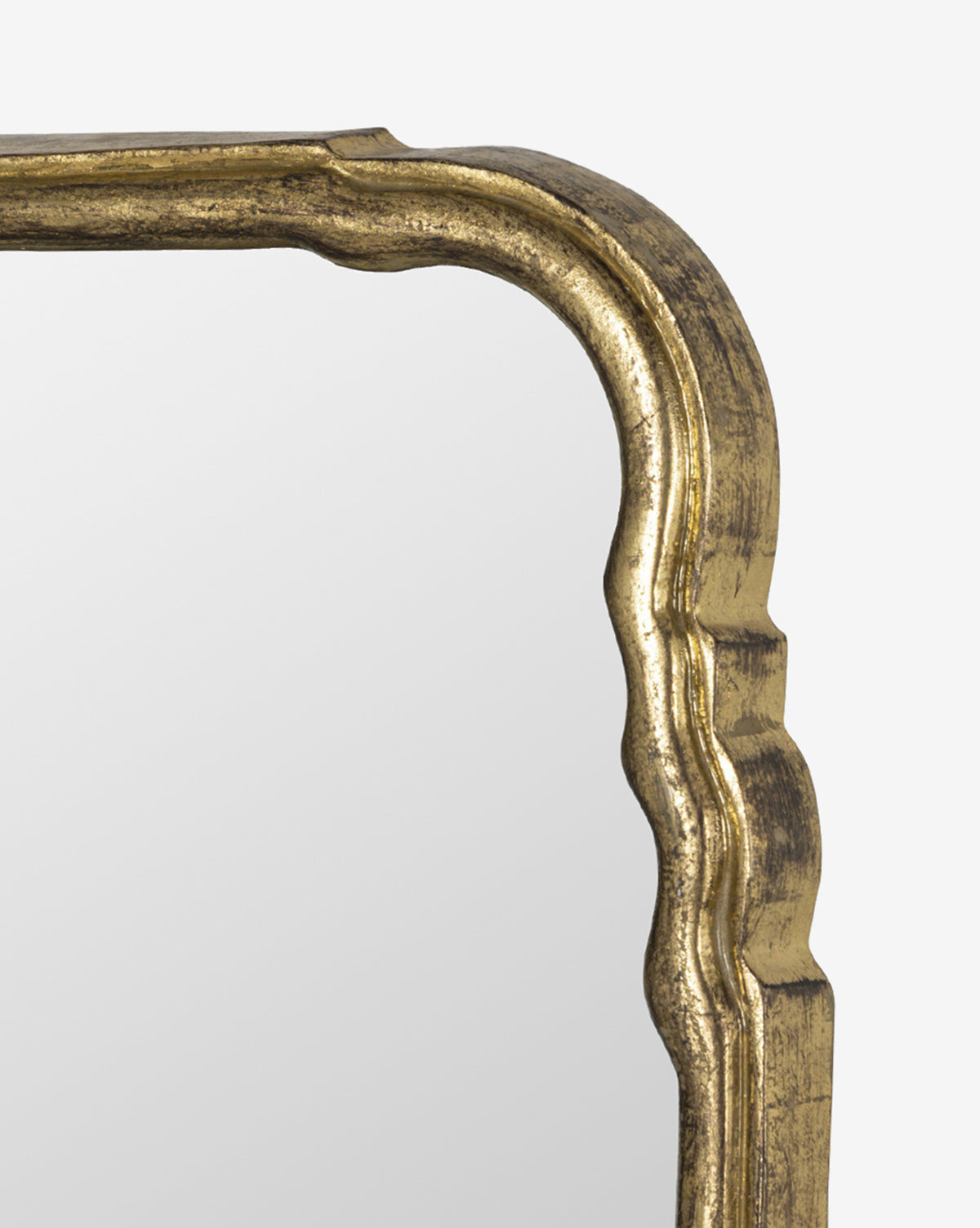 Close-up of the Zosia Wall Mirror’s top corner, showcasing its ornate, antique-style gold frame against a plain white background—perfect for adding elegant charm to your home decor, by Vendixs