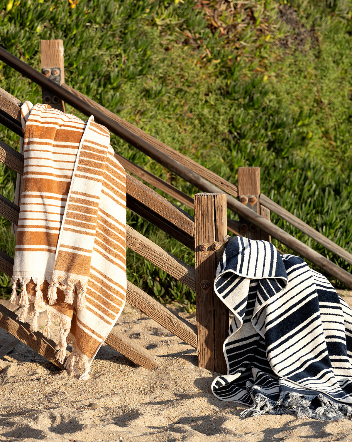 Large beach towels shown in camel and navy stripes from Vendixs