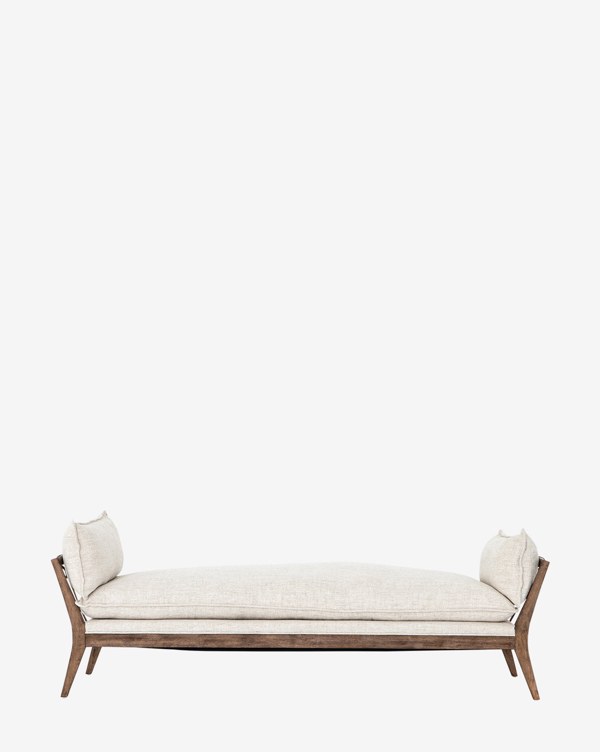 The Aberdeen Day Bed by Four Hands features a modern beige upholstered design with a sturdy parawood frame, wooden legs, and two matching side cushions, resembling a compact chaise, shown against a plain white background. Vendixs