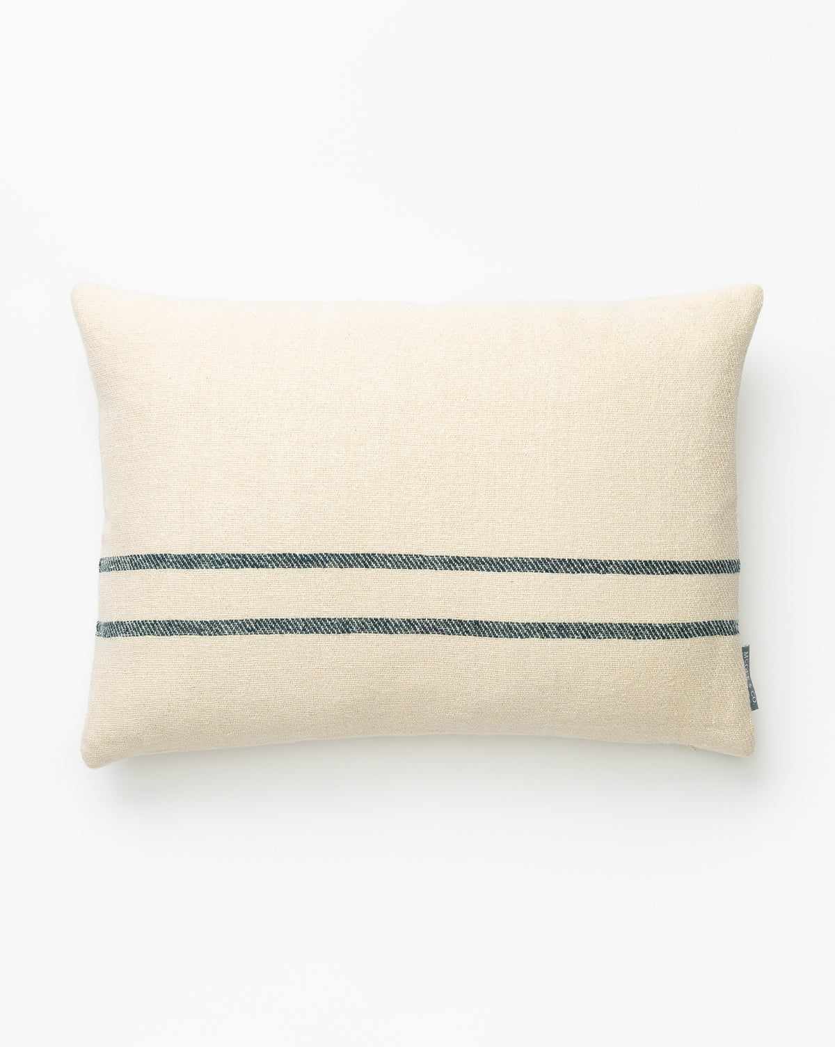 The Abigail Silk Stripe Pillow Cover is a rectangular, cream-colored handwoven design featuring two parallel dark gray stripes near one edge, shown against a plain white background by McGee & Co.