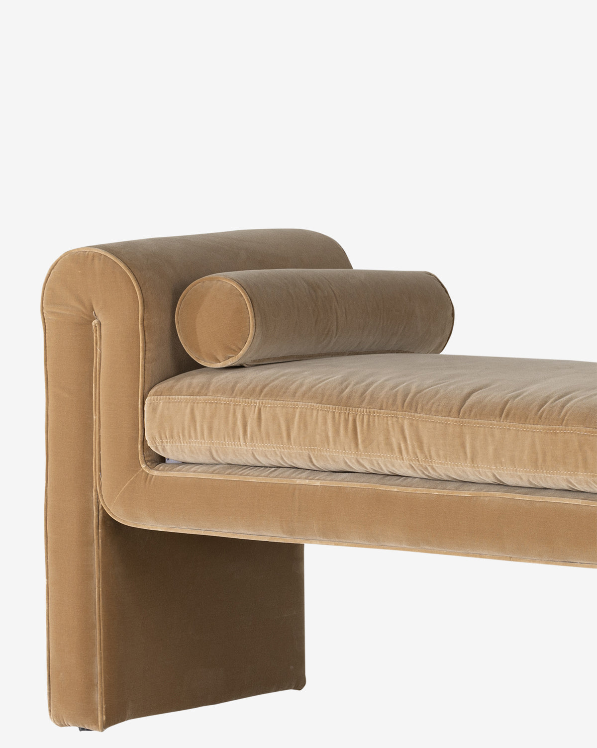 The Ashlyn Bench features modern upholstery in tan velvet with a rectangular backrest, cylindrical bolster pillow, and plush cushioning. Clean lines give it a contemporary style, shown here against a plain white background by Vendixs