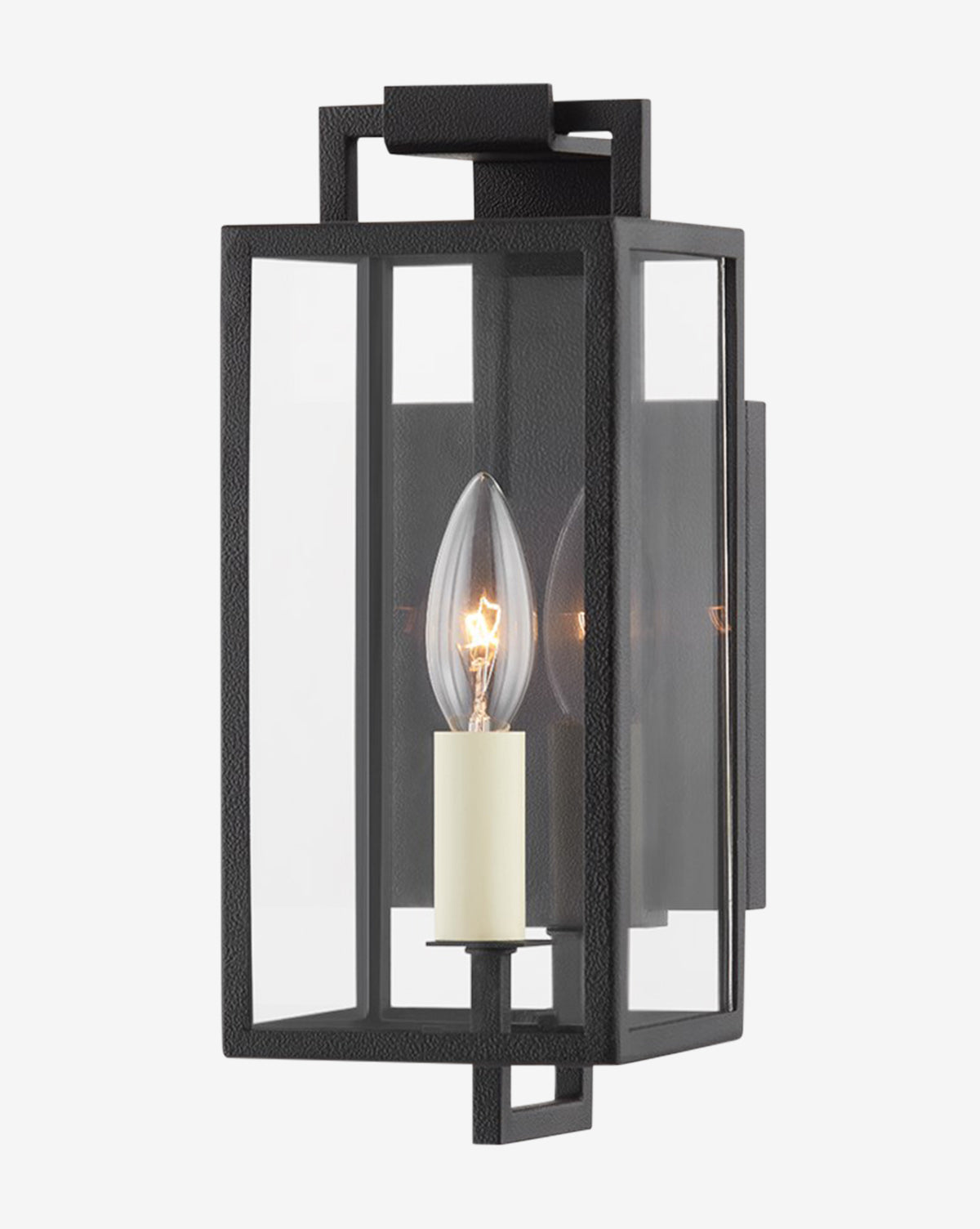 The Beckham Wall Sconce by Troy Lighting features a modern black metal frame, clear glass panels, and an exposed candle-style bulb on a rectangular backplate for sleek industrial charm. Vendixs