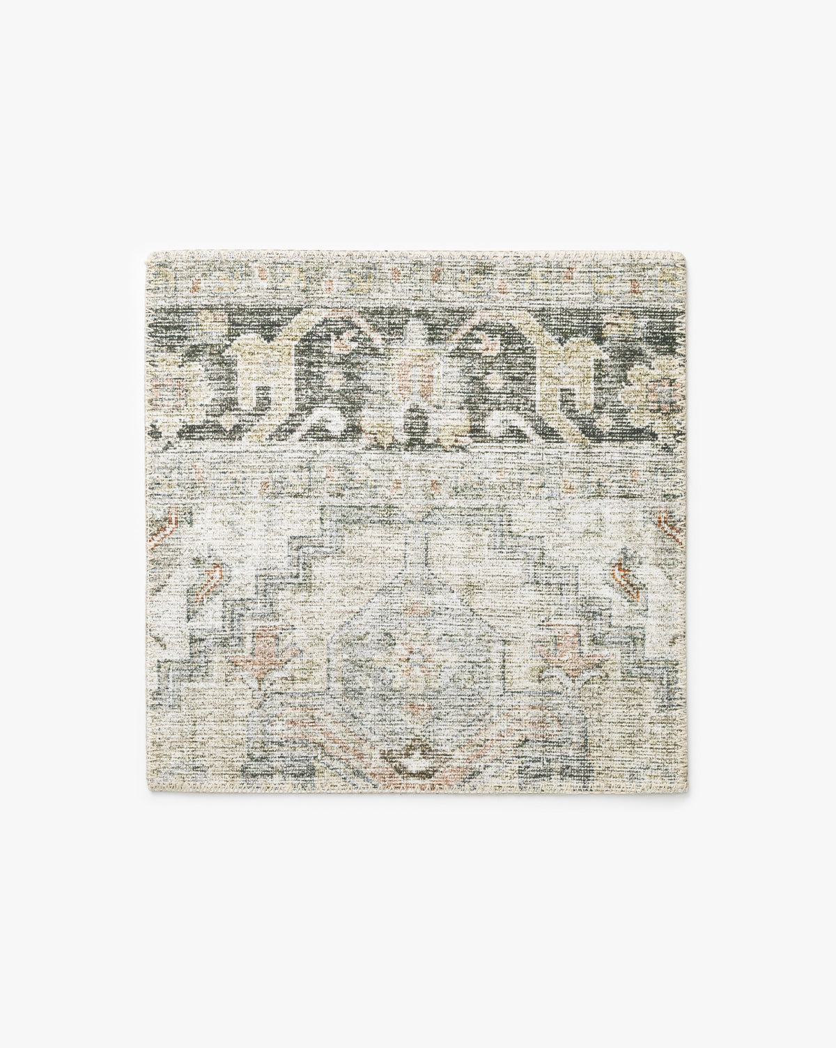 The Cassis Rug Swatch features a square shape with a vintage-inspired geometric and floral pattern in muted shades of gray, beige, and faded green, by Vendixs