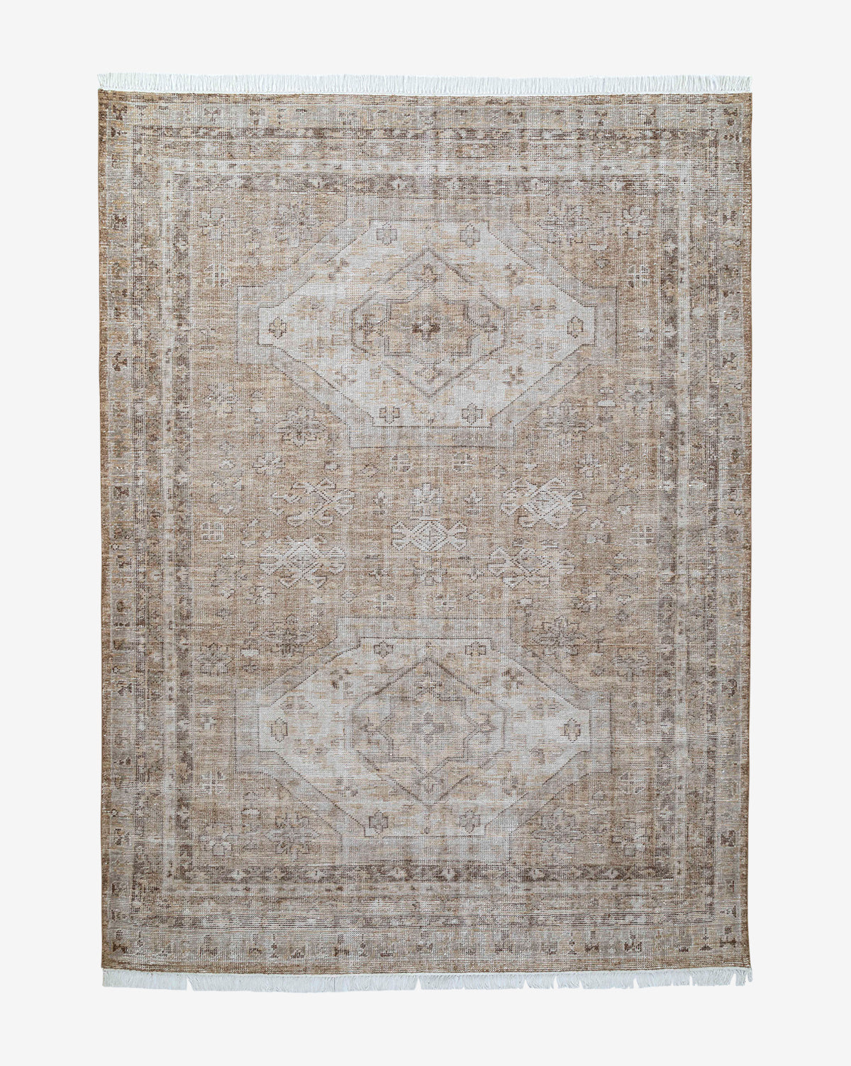 The Charlot Hand-Knotted Rug is a rectangular brown artisan piece featuring a faded geometric and floral design, lighter bordered edges, and short white fringe on the shorter sides, by Vendixs