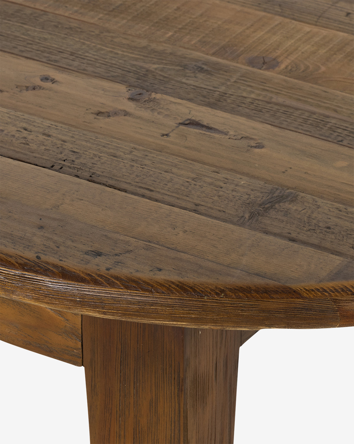 The Constance Dining Table features a rustic plank-style top and solid pine legs, blending modern farmhouse charm and highlighting the woods natural grain, knots, and texture, by McGee & Co.