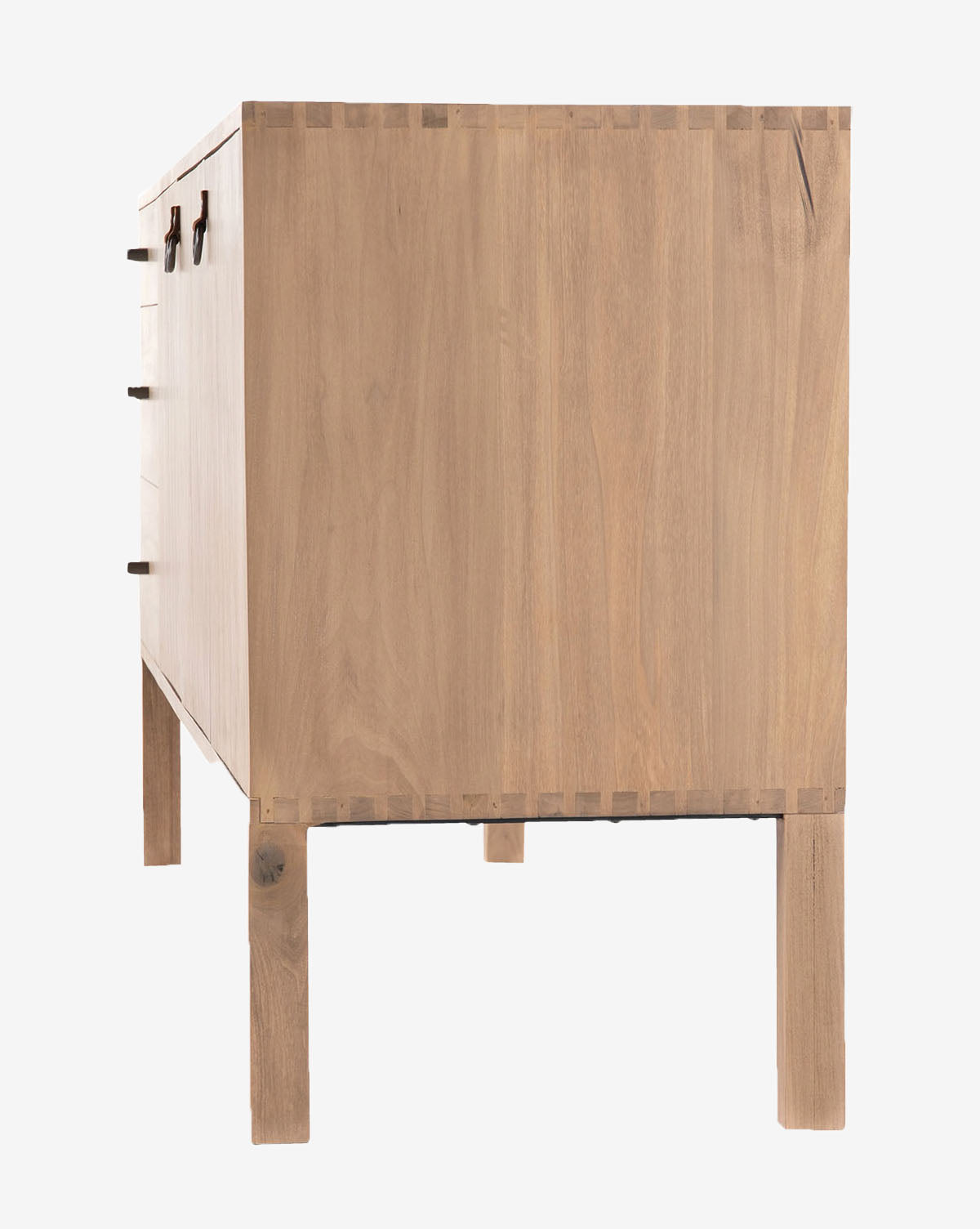 The Daylin Sideboard, shown from the side, features a smooth light wood finish and a shaker-inspired rectangular shape with dovetail joints, four straight legs, and partially visible front handles on the left, by Vendixs