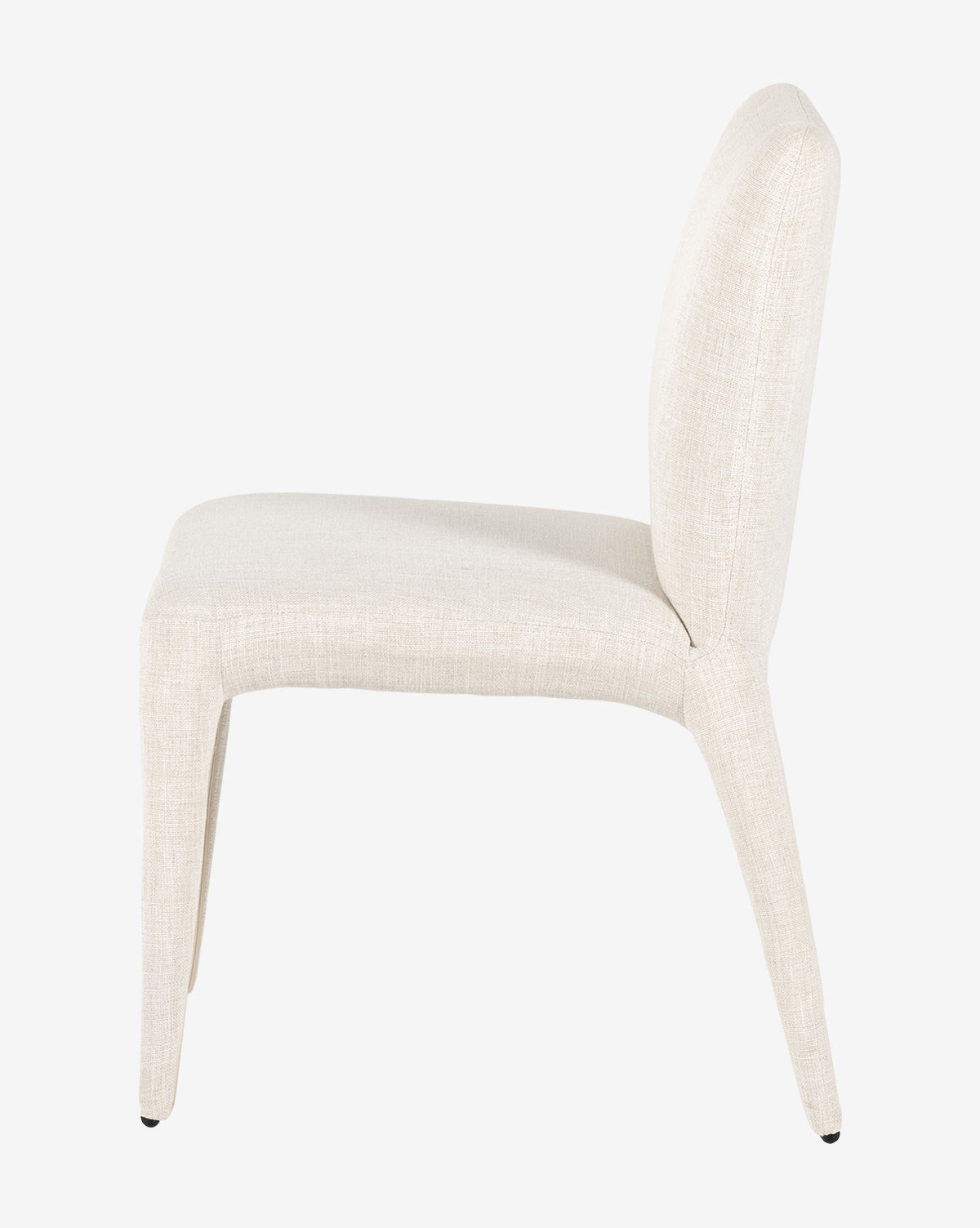 Side view of the Elbert Dining Chair, upholstered in light beige flax linen with a gently curved backrest and tapered legs, shown against a plain white background, by Vendixs