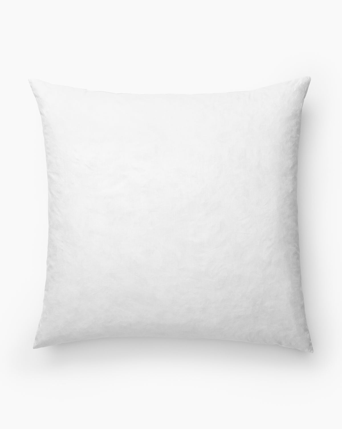 The Euro Pillow Insert is shown in white with a smooth, plush surface against a white background. This square-shaped cotton pillow insert offers added comfort and is perfect for enhancing your home décor, by Vendixs