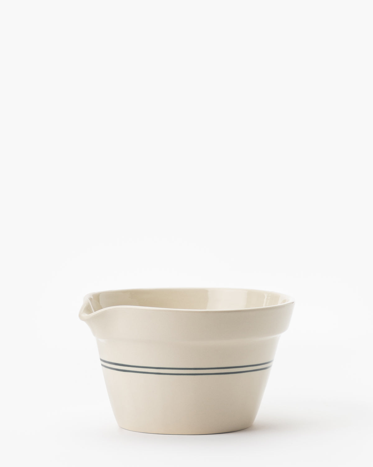 The Everett Mixing Bowl, cream-colored with two thin green stripes near the base and a spout on one side, is displayed against a plain white background by Vendixs