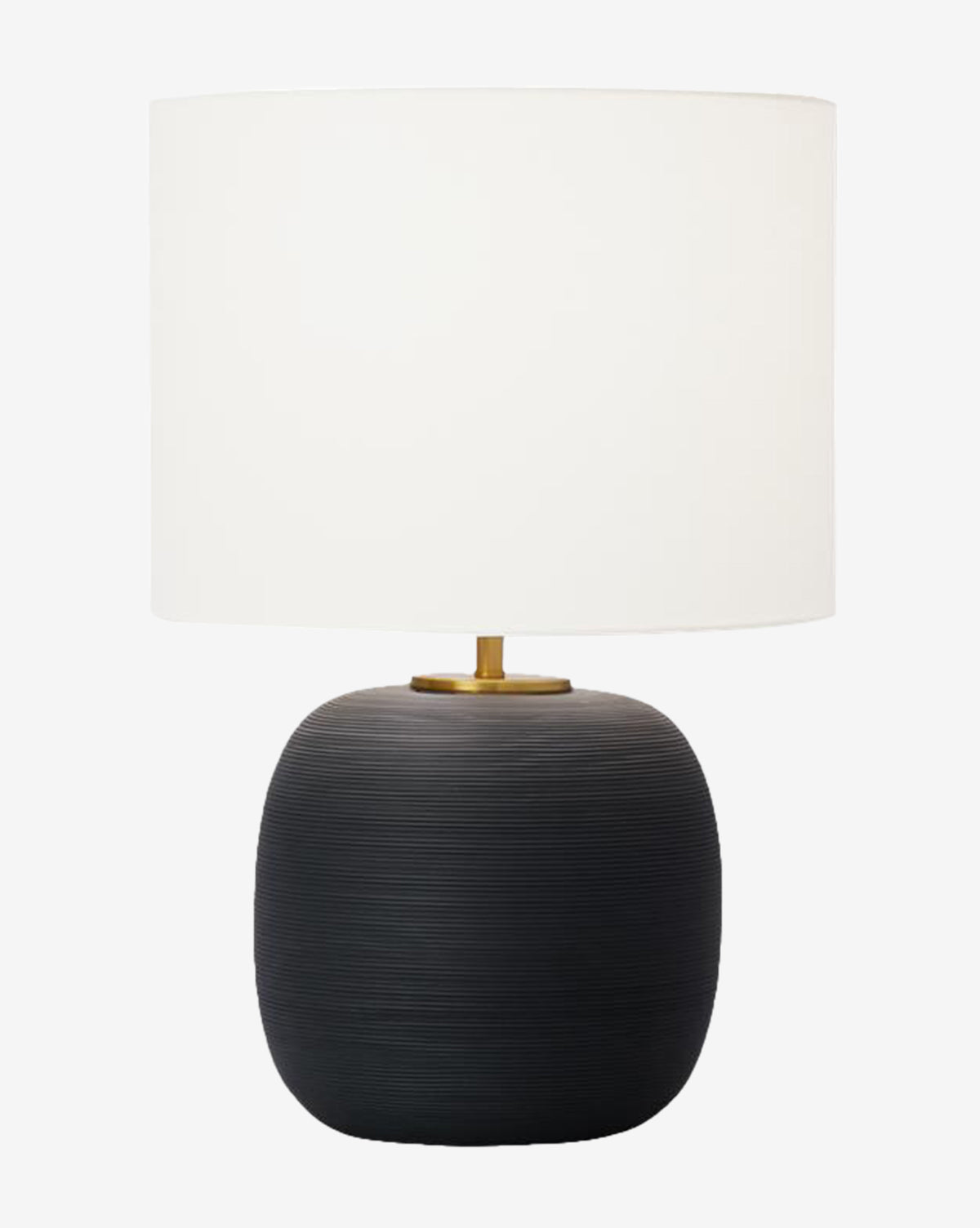 The Fanny Table Lamp has a large white drum shade, a rounded black ceramic base with a textured finish, and a gold accent at the top where the shade attaches, by Vendixs