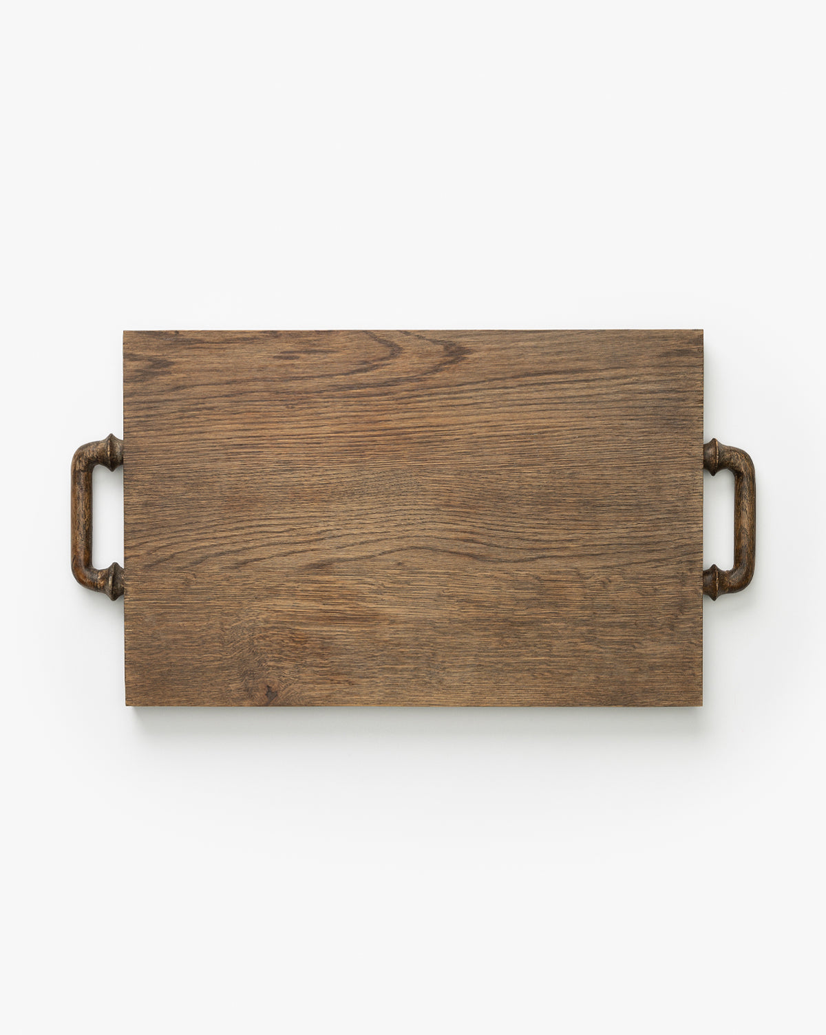 The Fordham Board is a rectangular solid oak serving tray with visible wood grain and metal handles on each short end, ideal as a charcuterie serving board, shown on a white background by Vendixs