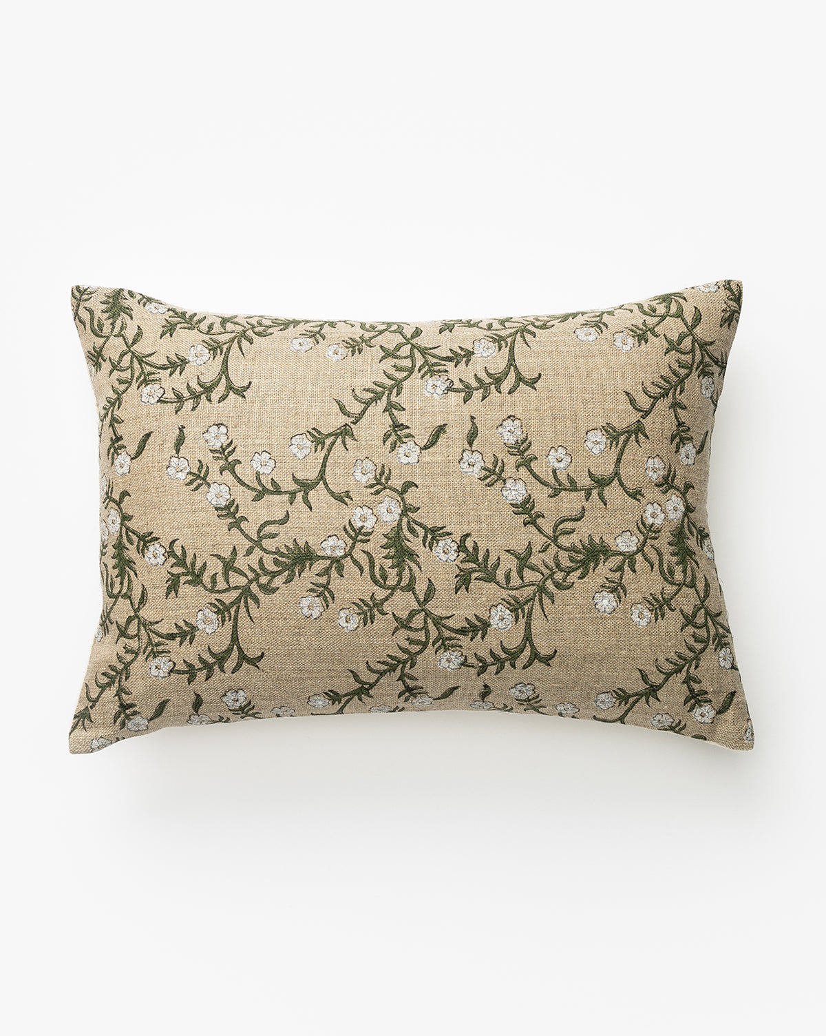 The Gia Pillow Cover features a rectangular design with a beige background and green vines with white flowers embroidered on linen, shown on a white surface by McGee & Co.