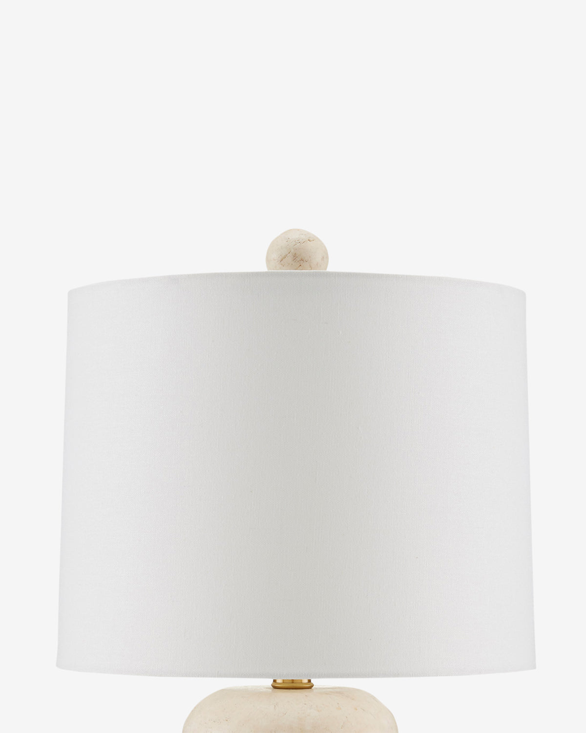 A close-up of the Girault Table Lamp featuring organic travertine texture, a round textured finial, and a smooth cylindrical shade, shown against a plain white background by Vendixs