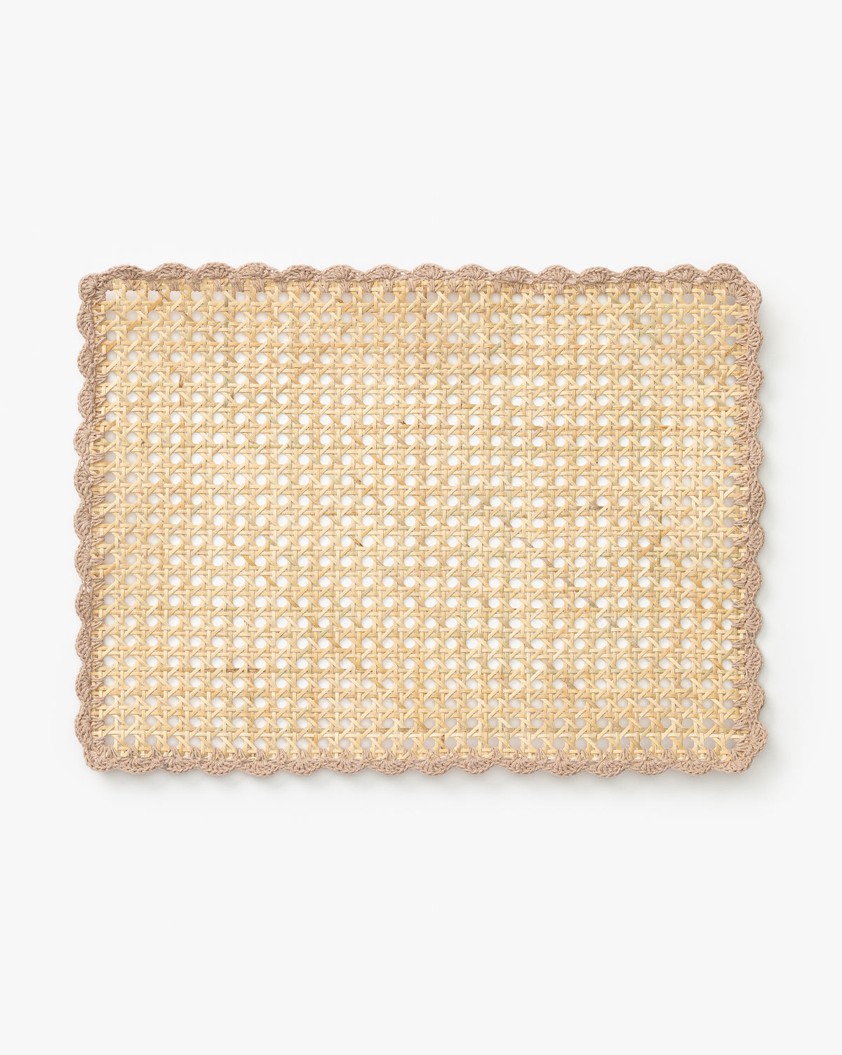 The Gloria Cane Placemat is a rectangular bamboo mat in natural beige with a scalloped light brown border, bringing subtle coastal flair. Shown on a plain white background by McGee & Co.