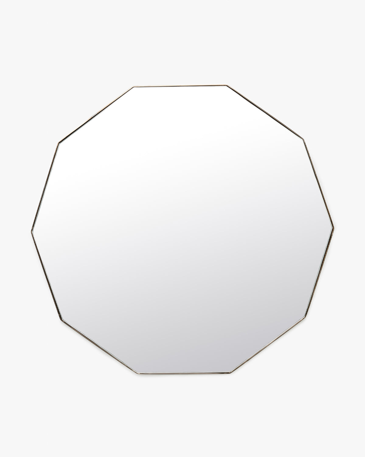 The Hawley Decagon Mirror is a round, frameless wall mirror with a subtle octagonal edge, shown against a plain white background, by Vendixs