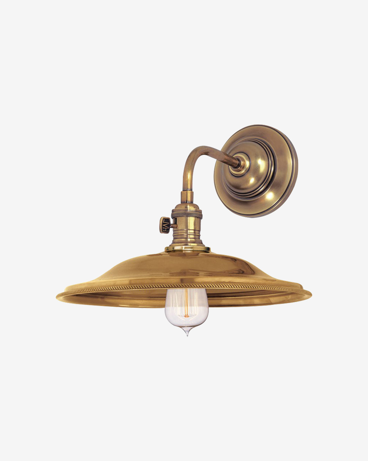 The Hudson Valley Lighting Heirloom Sconce features a round backplate, curved arm, and wide shade, displaying an exposed Edison-style bulb for timeless industrial style. Vendixs