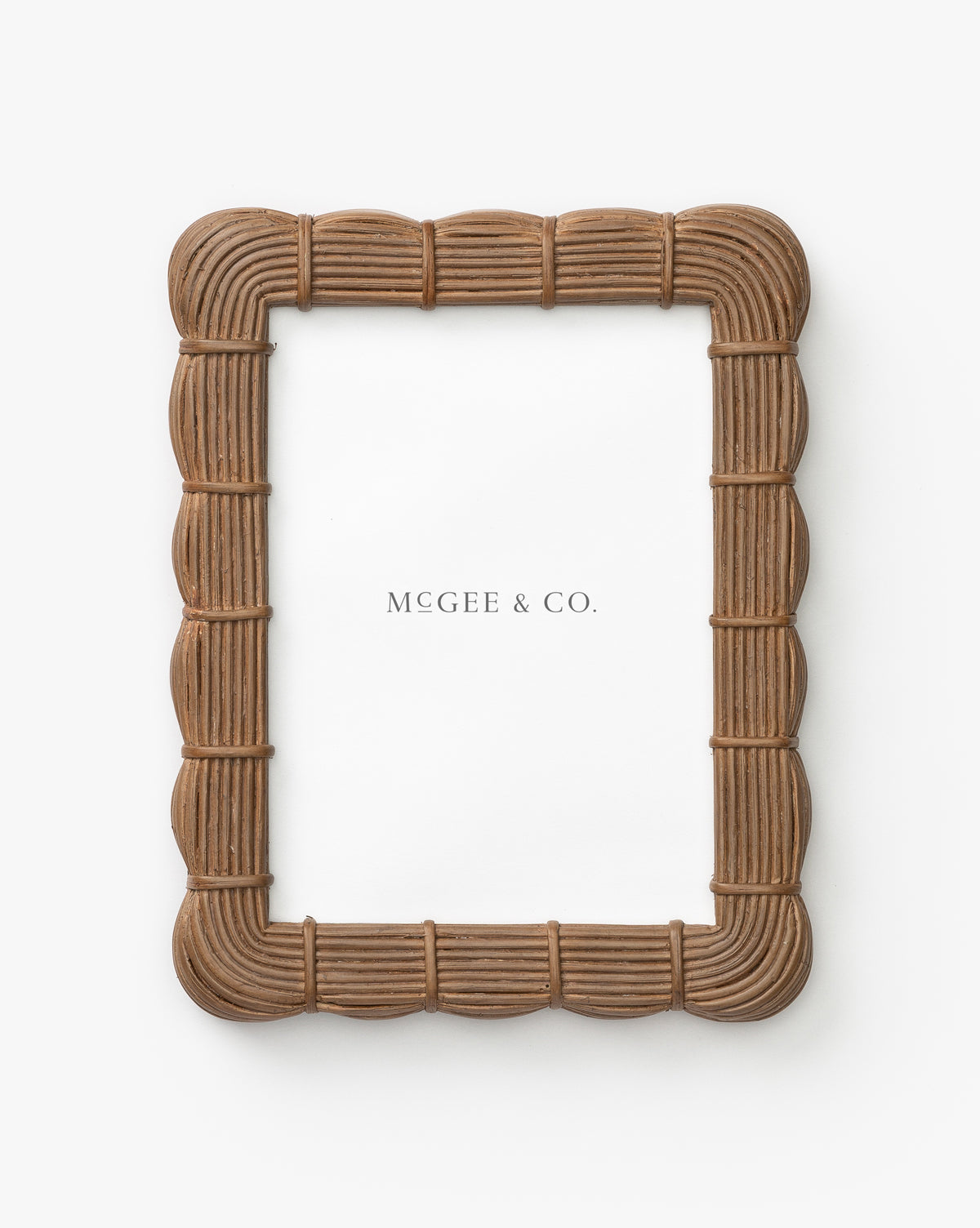 The Hilde Woven Frame is a rectangular brown picture frame featuring an organic woven texture, shown against a white background with a placeholder paper labeled Vendixs