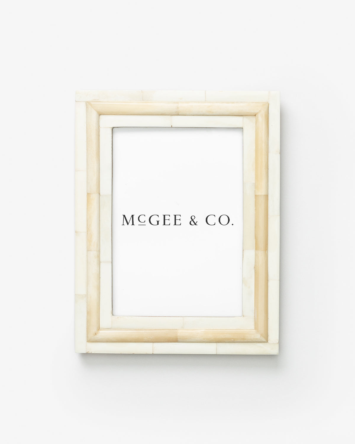 The Inlay Bone Frame is a rectangular photo frame featuring a beige and cream tiled border with elegant bone trim, shown against a plain white background with an insert labeled Vendixs