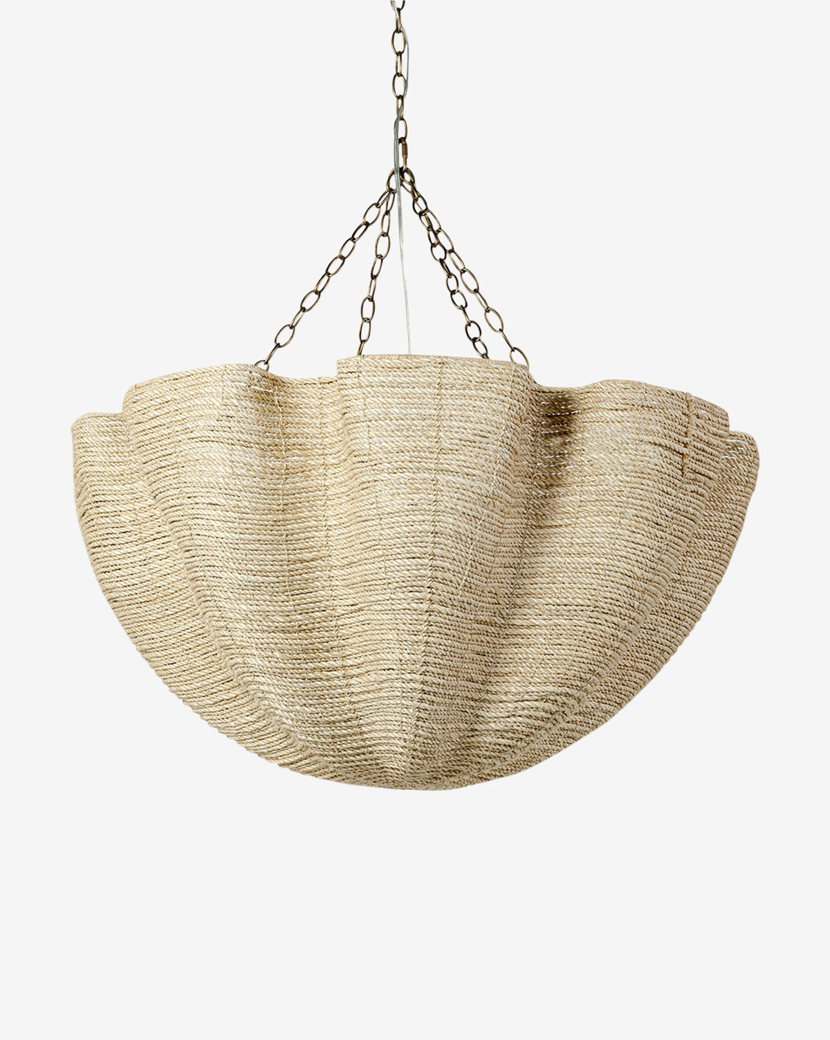 The Isla Chandelier by Palecek features organic pleats and a scalloped, natural woven shade, suspended by three metal chains, shown against a plain white background. Vendixs