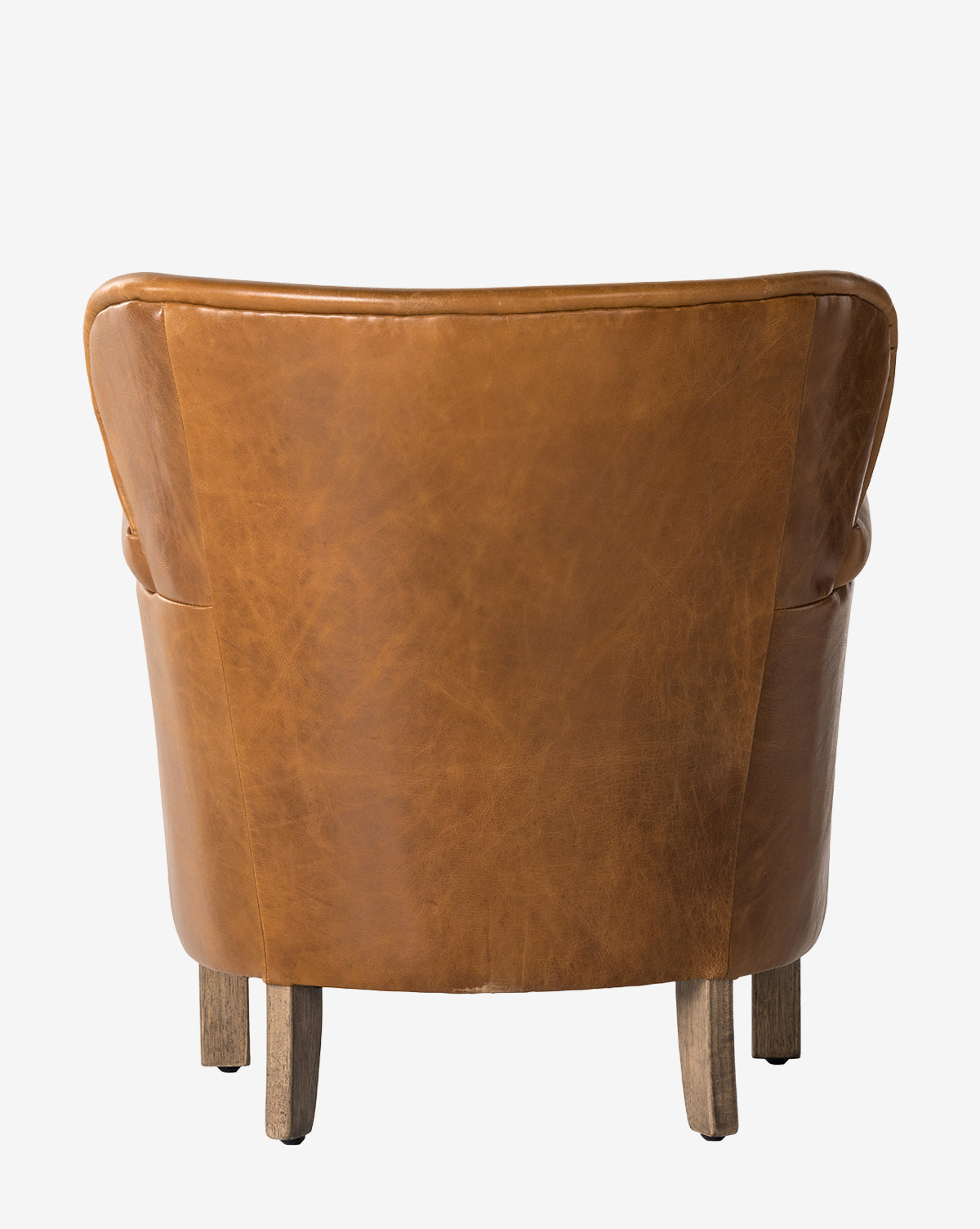 The Jarah Lounge Chair is shown from behind, featuring brown top-grain leather, a curved silhouette, and four wooden legs against a plain white background, by Vendixs