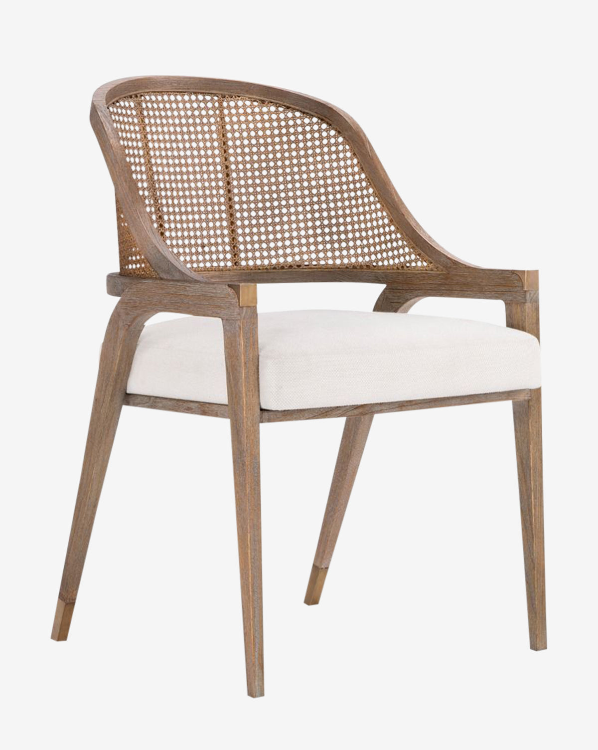 The Jensen Dining Chair combines classic and modern styles with a hand-woven cane back, armrests, a white upholstered seat cushion, and angled legs in solid Cape Lilac Mahogany, by Vendixs