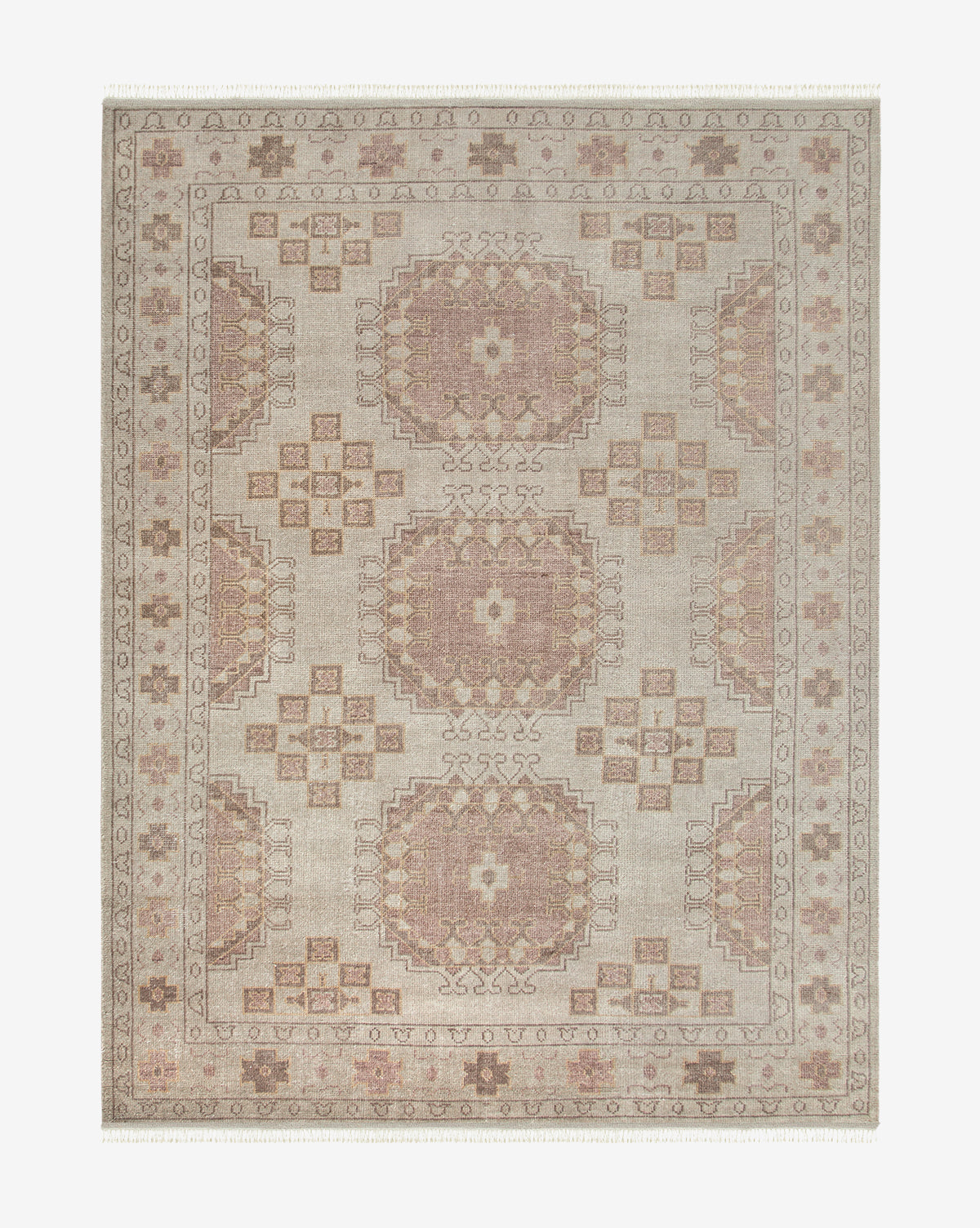 The Kenna Hand-Knotted Wool Rug is a rectangular beige and blush rug with a geometric medallion pattern, intricate border details, soft muted tones, and symmetrical designs throughout, by Vendixs
