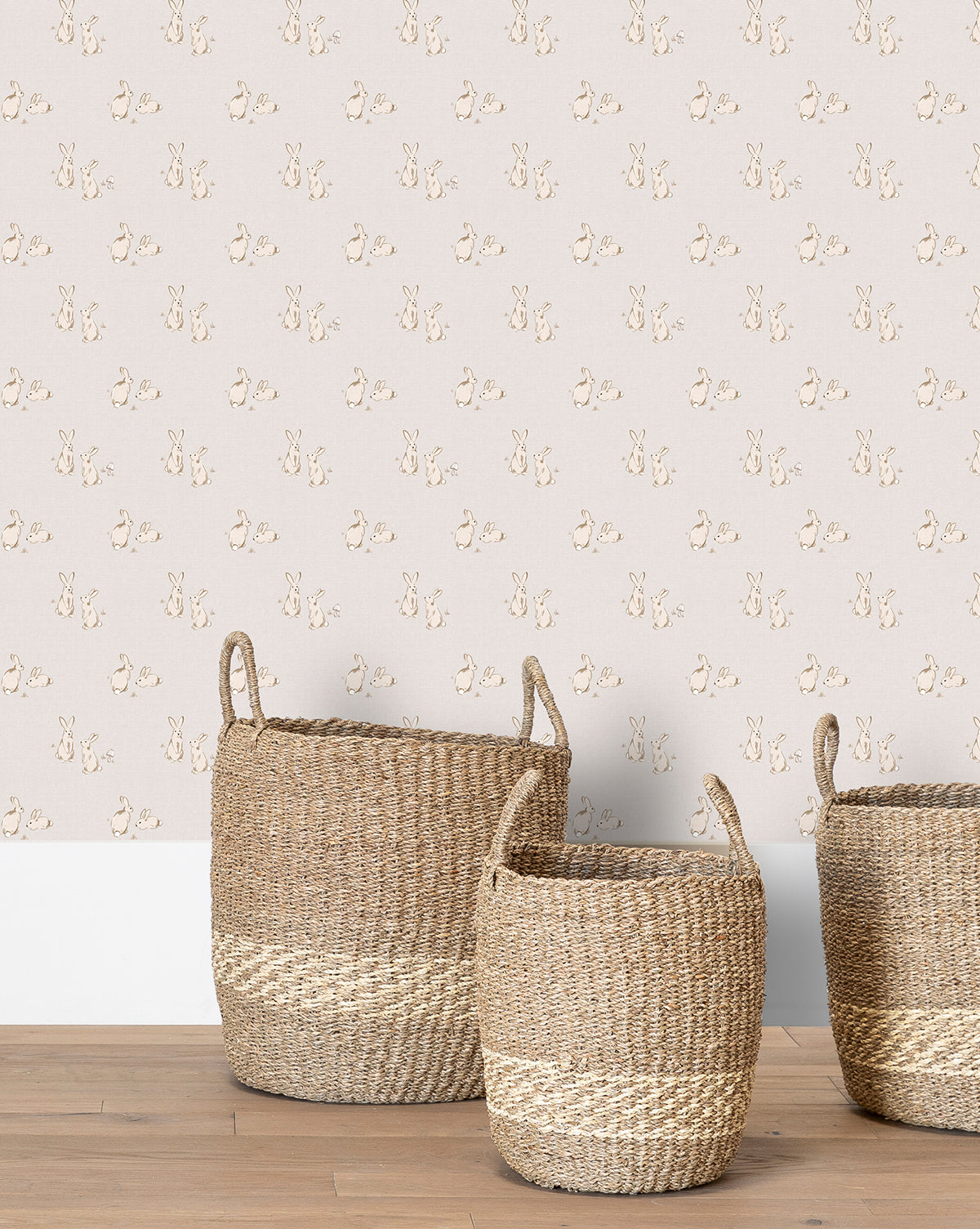 Wallpaper in pastel tones with whimsical bunny pairs on a gray backdrop for a charming nursery by Vendixs