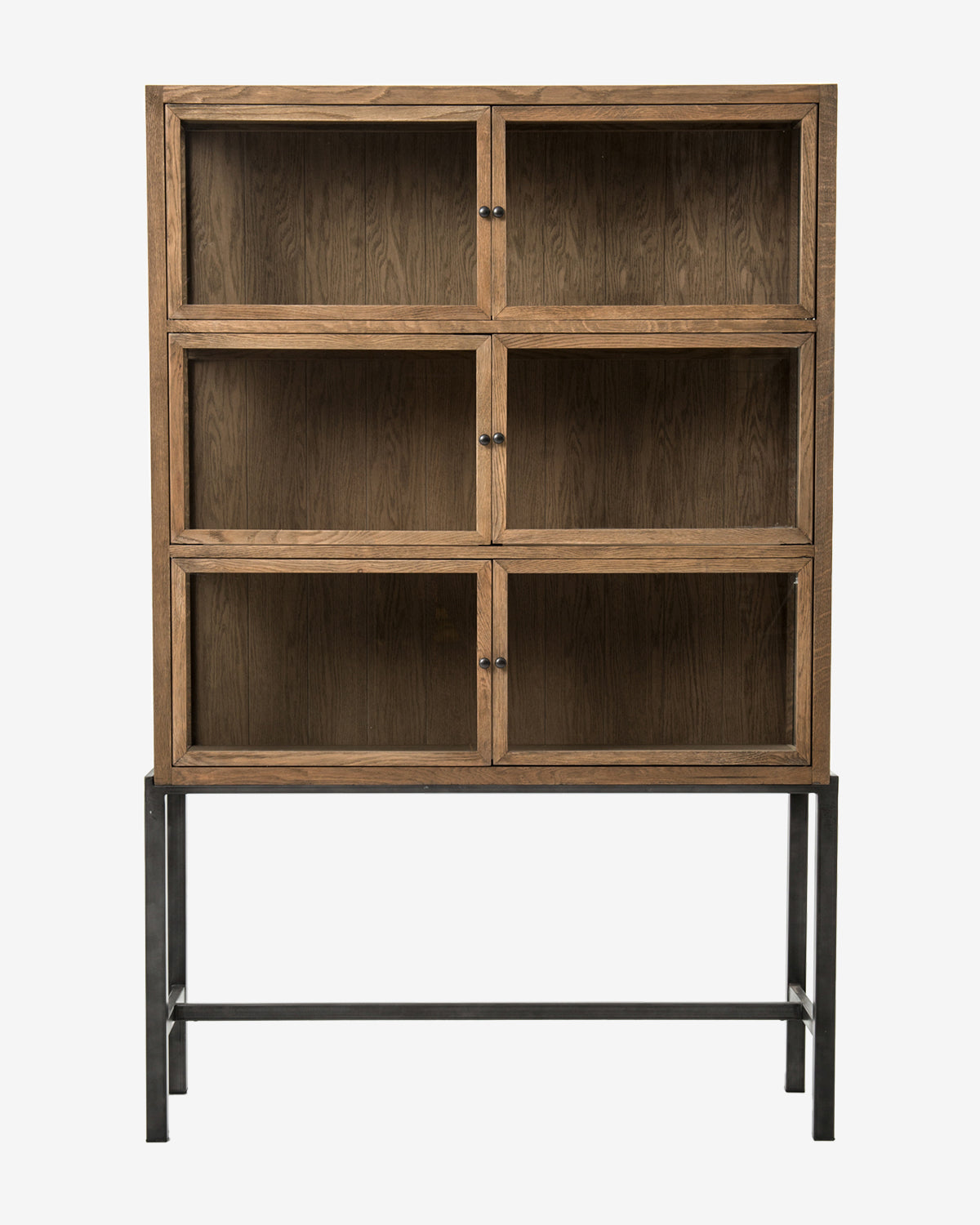 The Lawley Cabinet is a tall, drift oak curio with six glass-front compartments and black knobs on a black metal frame. Its minimalist, modern design brings elegance to any space, by Vendixs
