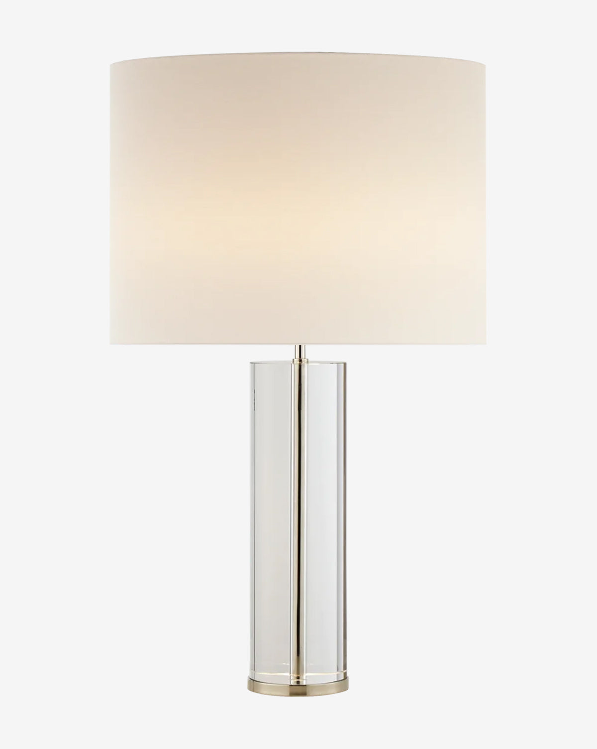 The Lineham Table Lamp features a modern cylindrical clear glass base and a large round white fabric lampshade, softly glowing with ambient light by Vendixs