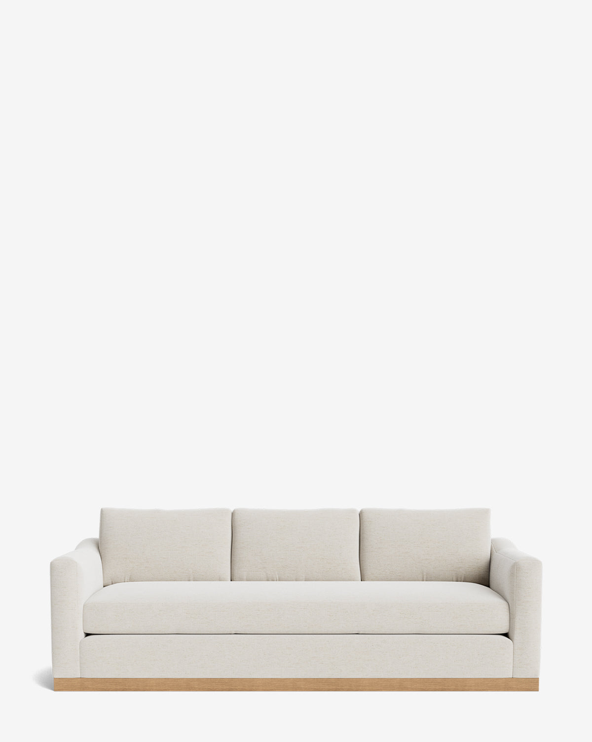 The Vernon Sofa 92 by Community is a modern three-seater with light beige velvet, square arms, three back cushions, and a wooden base—an ideal customizable sofa for any contemporary space. Vendixs