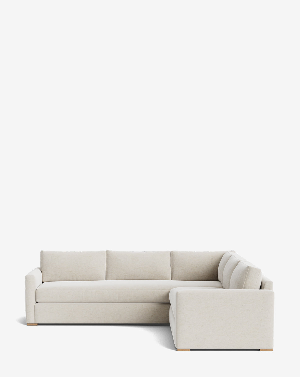 The Community Macy Upholstered L Sectional 108 is a beige sofa with down-wrapped cushions, three seat and back cushions, and low arms, shown against a plain white background. Vendixs