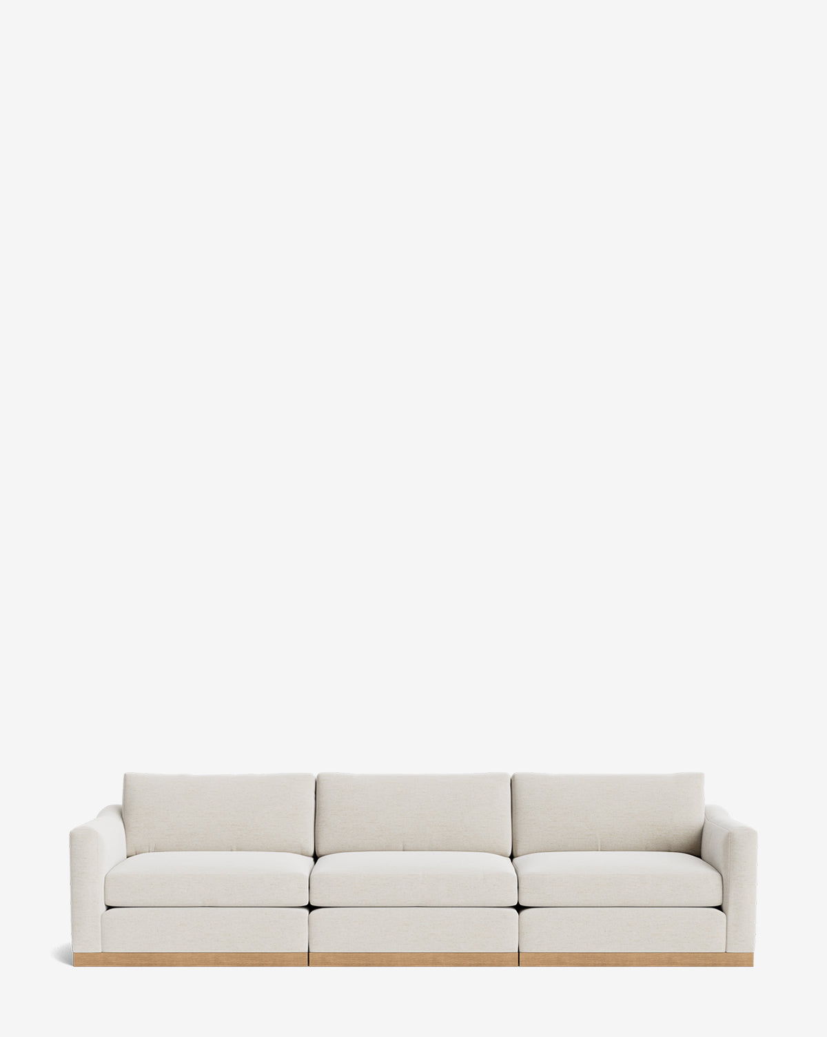 The Vernon Modular Sofa (121-157) by Community is a modern three-seat sofa featuring light beige velvet upholstery and a wooden base, displayed against a plain white background by Vendixs
