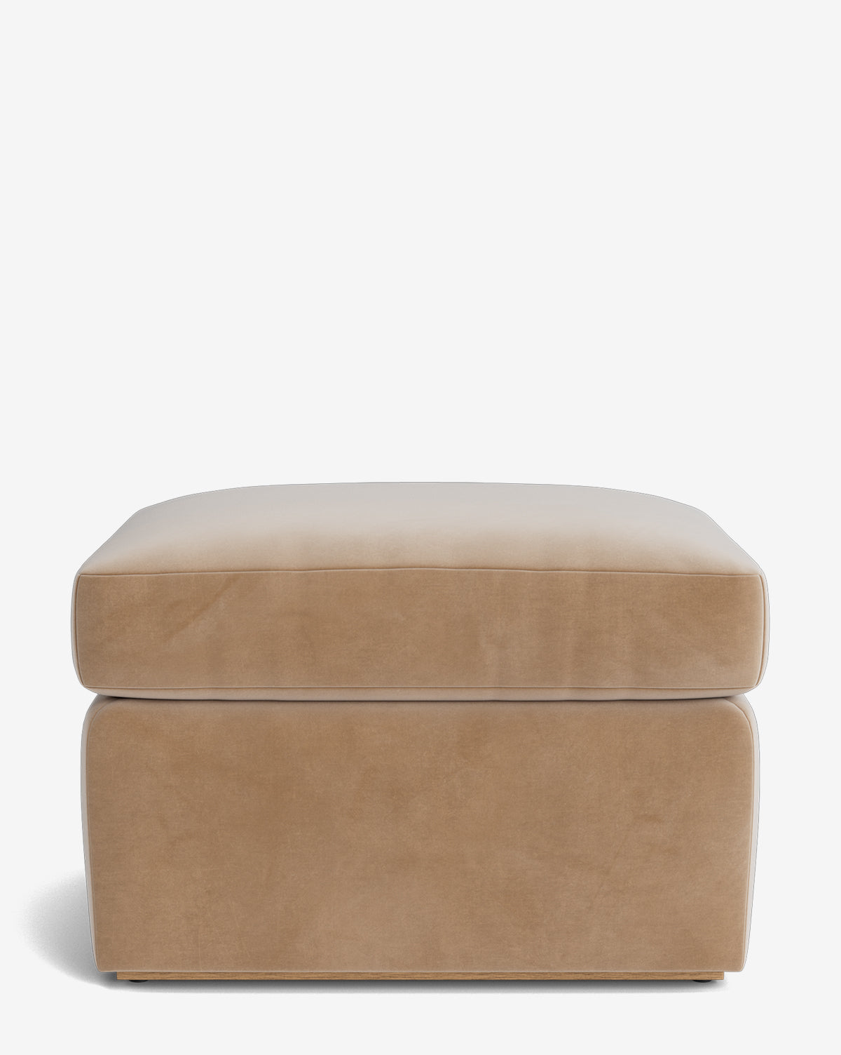 The Reese Ottoman by Community is a beige, rectangular ottoman with smooth upholstery and cushioned sides and top. Its modern, minimalist design offers comfort and style for any space. Vendixs