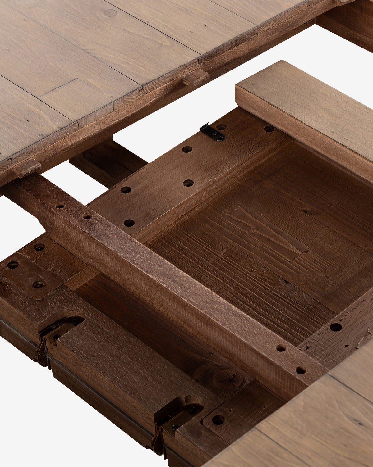 Close-up of the Elisha Extension Dining Table with its top separated, showing the butterfly leaf mechanism and support beams. The table features a natural wood finish with visible grain patterns, by Vendixs