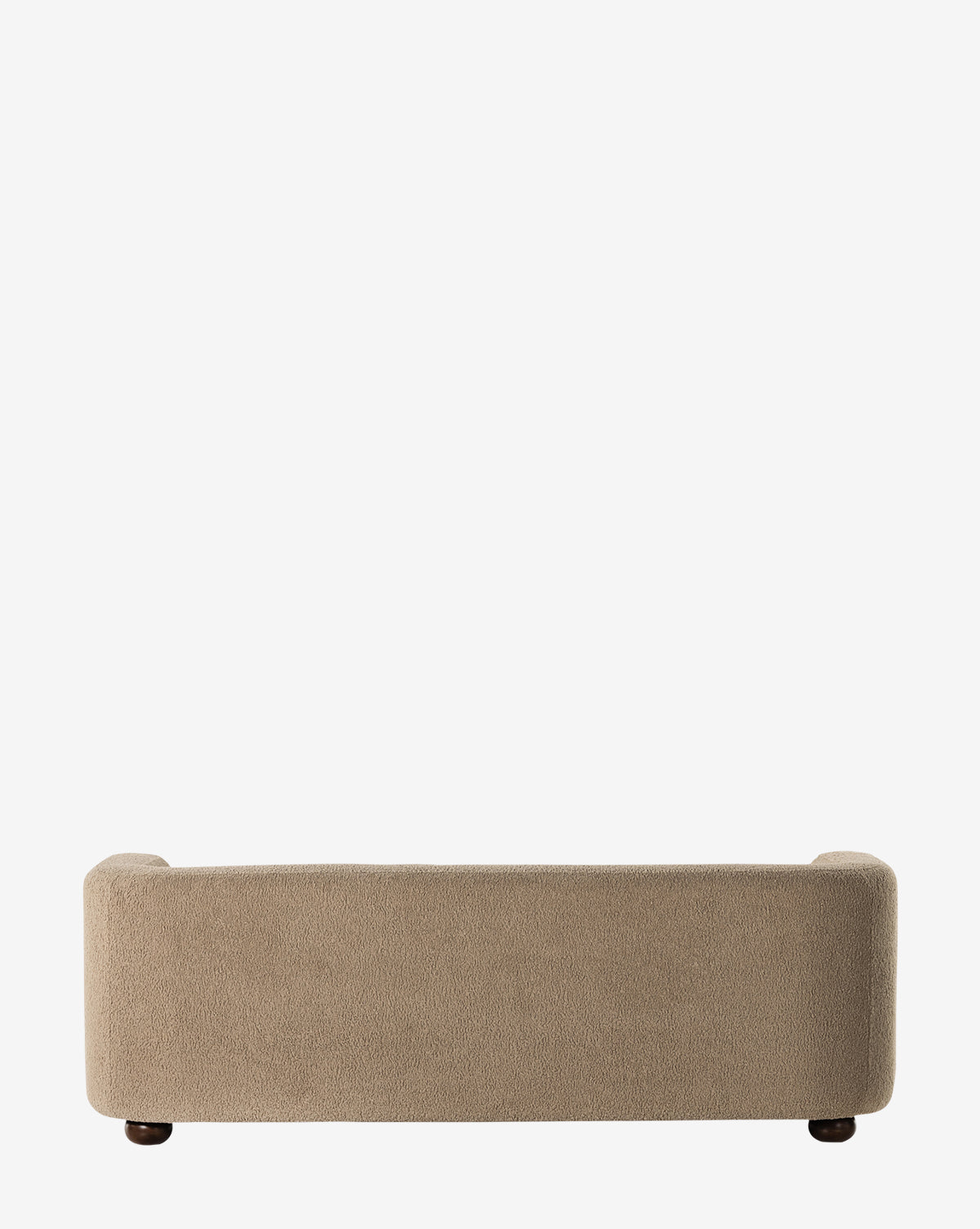 The Four Hands Quill Sofa 84 is a beige upholstered vintage sofa with rounded arms and back, shown from behind against a white background. It features short, dark wooden legs for a classic touch. Vendixs