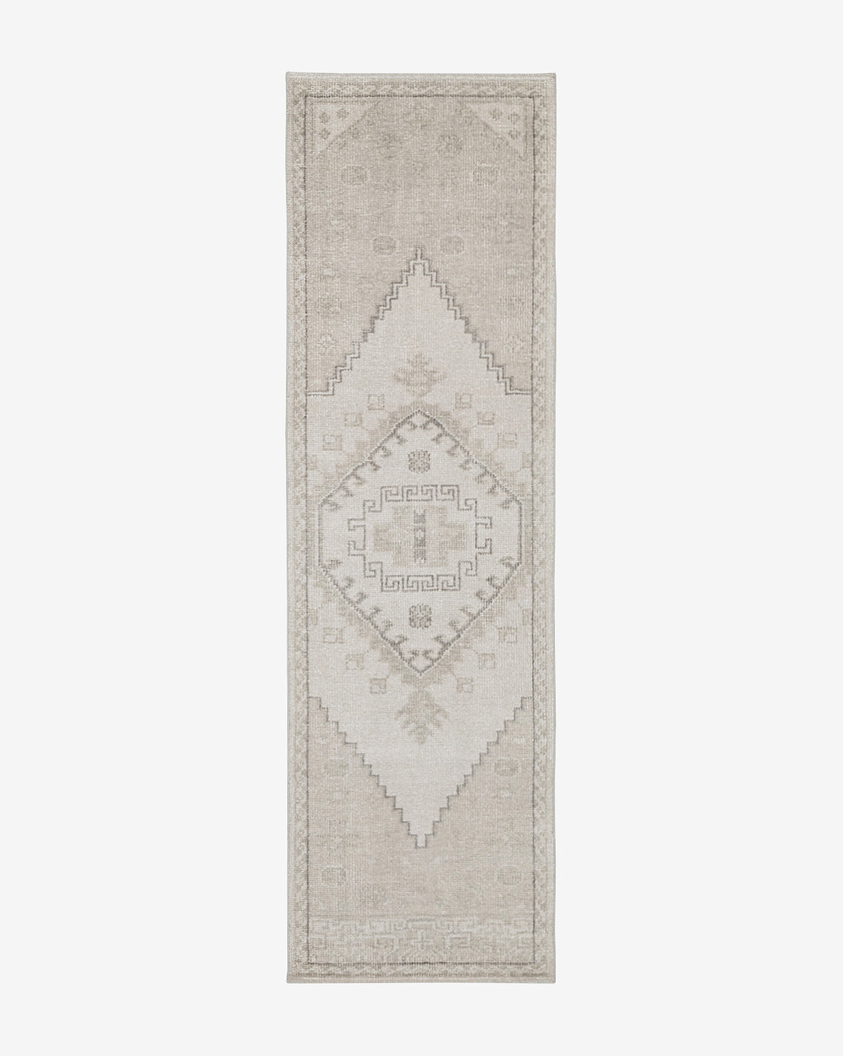 The Pembroke Hand-Knotted Wool Rug is a long, narrow beige runner with subtle geometric diamond patterns and decorative borders, adding timeless vintage-inspired charm and neutral tones to any space, by Vendixs