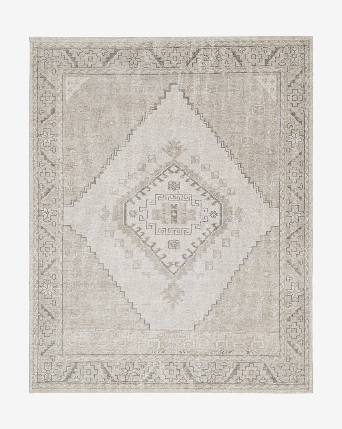 The Pembroke Hand-Knotted Wool Rug showcases a beige and gray vintage-inspired design with a central diamond, geometric motifs, and a detailed border in muted neutral tones, by Vendixs
