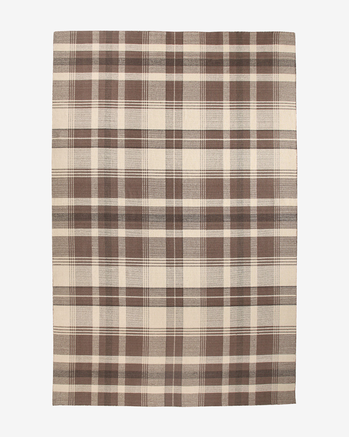 The Orton Handwoven Wool Rug is a rectangular wool rug with a large-scale plaid pattern in brown and beige, featuring intersecting lines for a classic checkered look, by Vendixs