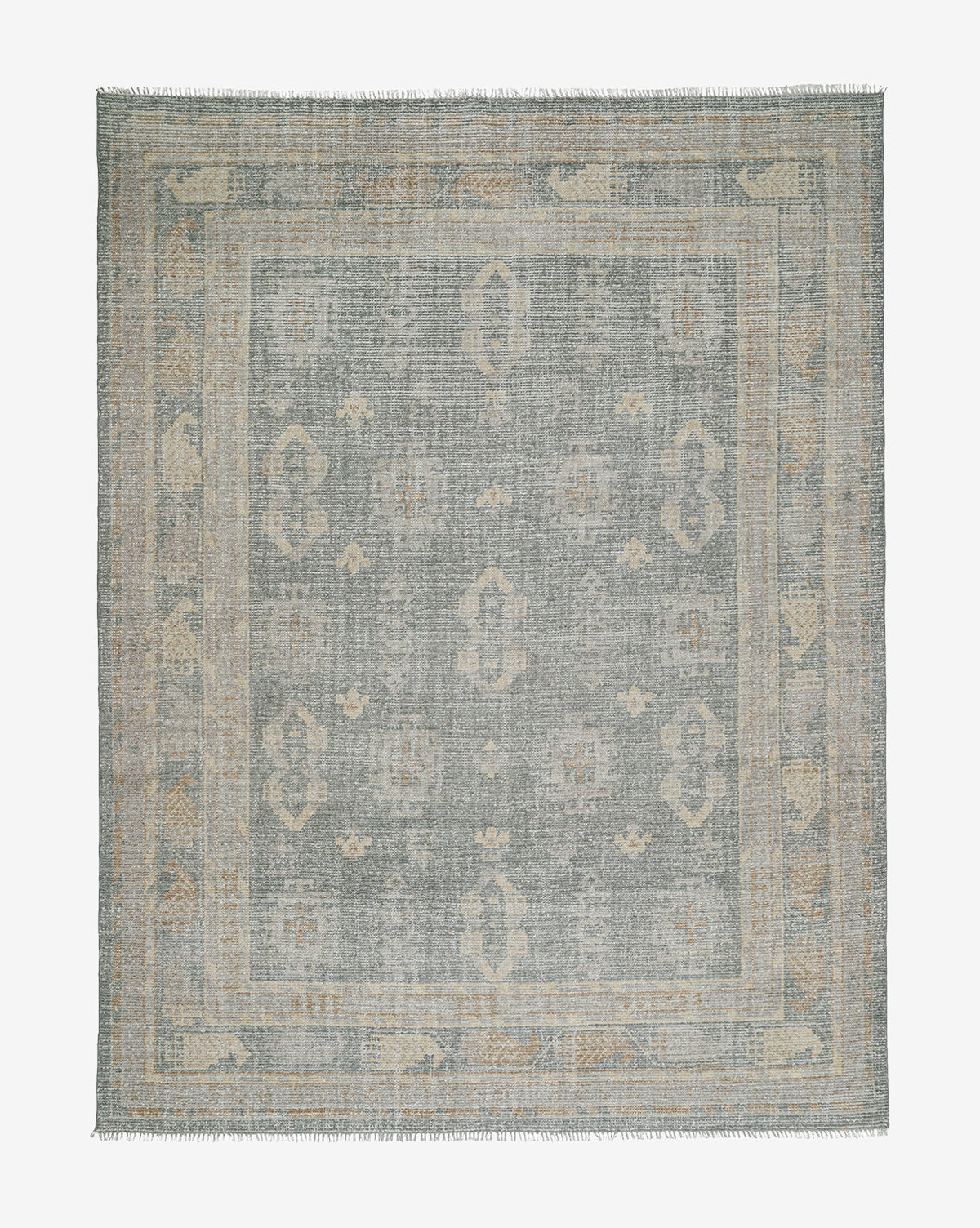 The Roslin Hand-Knotted Wool Rug is a square wool rug with a muted, distressed pattern in soft blue and beige, decorative border, and fringed edges, by Vendixs